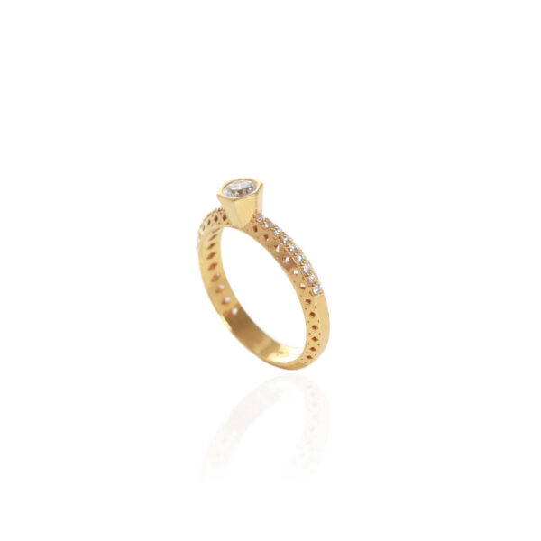 18K gold Antissa Brilliant diamond ring with a bezel-set round brilliant-cut centre diamond and pavé-set band by Elsa Mouzaki